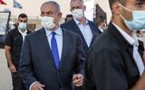 Prime Minister Benjamin Netanyahu (C-L) and his coalition partner Defense Minister Benny Gantz (C-R), attend a graduation ceremony for new pilots in Hatzerim air force base near Beersheba, on June 25, 2020. (Ariel Schalit / POOL / AFP)