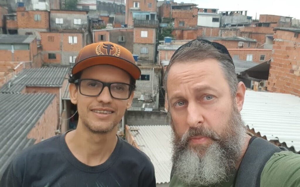 Rabbi Gilberto Ventura, right, and volunteers prepare to dispatch food packages to a needy residents of Sao Paulo, Brazil, May 27, 2020. (Courtesy of Sinagoga sem Fronteiras/via JTA)