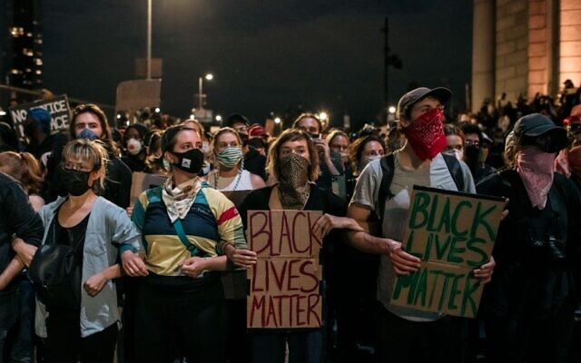 Protesters denouncing police brutality and systemic racism are kept in place on the Manhattan Bridge, June 2, 2020, by police for hours during a citywide curfew in New York City. Days of protest, sometimes violent, have followed in many cities across the country in response to the death of George Floyd while in police custody in Minneapolis, Minnesota on May 25th. (Scott Heins/Getty Images/AFP) Protesters denouncing police brutality and systemic racism are kept in place on the Manhattan Bridge, June 2, 2020, by police for hours during a citywide curfew in New York City. Days of protest, sometimes violent, have followed in many cities across the country in response to the death of George Floyd while in police custody in Minneapolis, Minnesota on May 25th. (Scott Heins/Getty Images/AFP)