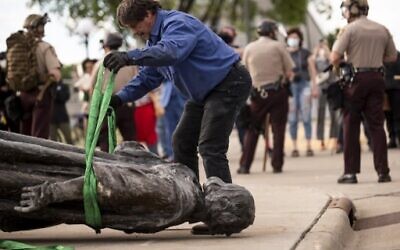 A statue of Christopher Columbus, which was toppled to the ground by protesters, is loaded onto a truck on the grounds of the State Capitol on June 10, 2020 in St Paul, Minnesota. (Stephen Maturen/Getty Images/AFP)