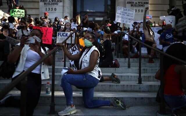 Demonstrators gather at the John A. Wilson Building during a protest against police brutality and racism on June 6, 2020 in Washington, DC. (Chip Somodevilla/Getty Images/AFP) Demonstrators gather at the John A. Wilson Building during a protest against police brutality and racism on June 6, 2020 in Washington, DC. (Chip Somodevilla/Getty Images/AFP)