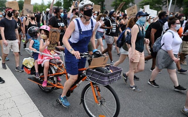Demonstrators march on Pennsylvania Avenue during a protest against police brutality and racism on June 6, 2020 in Washington, DC. (Chip Somodevilla/Getty Images/AFP) Demonstrators march on Pennsylvania Avenue during a protest against police brutality and racism on June 6, 2020 in Washington, DC. (Chip Somodevilla/Getty Images/AFP)