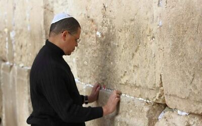 Illustrative: John Eaves, seen on a visit to Israel's Western Wall, says being black and Jewish has made him more attuned to bigotry. (Courtesy of Eaves/via JTA)