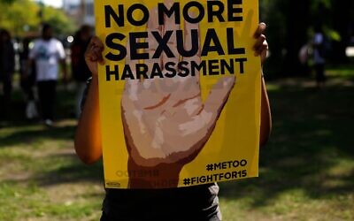 Illustrative: A sign at a protest in Chicago against sexual harassment in the workplace, September 18, 2018. (Joshua Lott/AFP via Getty Images via JTA)