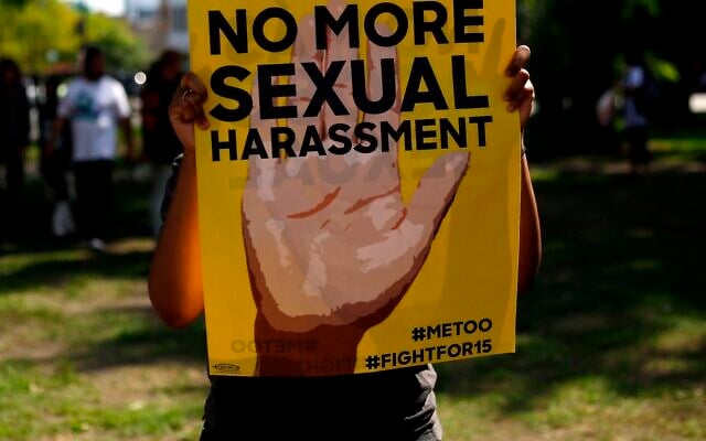 Illustrative: A sign at a protest in Chicago against sexual harassment in the workplace, September 18, 2018. (Joshua Lott/AFP via Getty Images via JTA) Illustrative: A sign at a protest in Chicago against sexual harassment in the workplace, September 18, 2018. (Joshua Lott/AFP via Getty Images via JTA)
