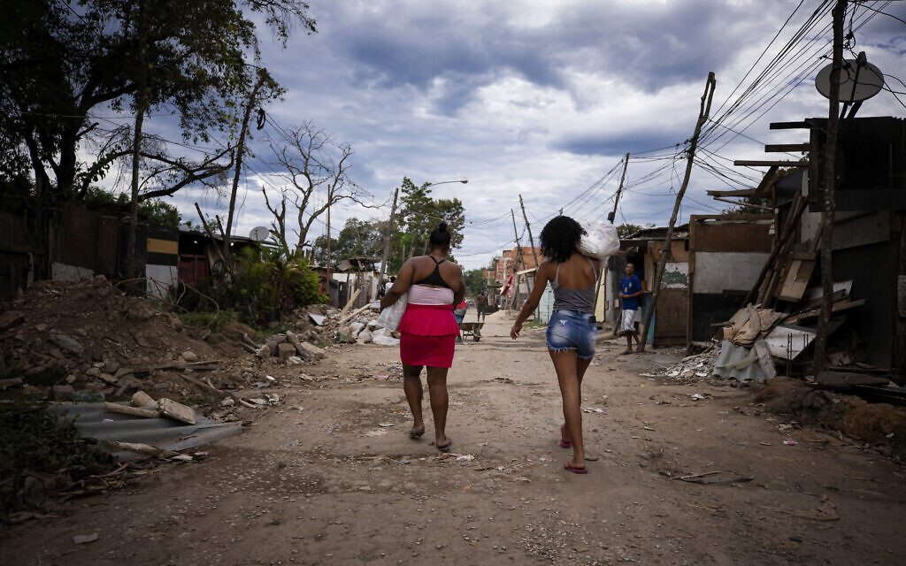 Illustrative: Residents of the Cidade de Deus Community receive food donations amidst the coronavirus (COVID-19) pandemic on May 23, 2020, in Rio de Janeiro, Brazil. (Buda Mendes/Getty Images/via JTA)