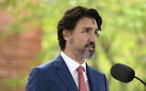 In this May 19, 2020, file photo, Canadian Prime Minister Justin Trudeau speaks during his daily news conference on the COVID-19 pandemic outside his residence at Rideau Cottage in Ottawa, Ontario. (Justin Tang/The Canadian Press via AP, File)