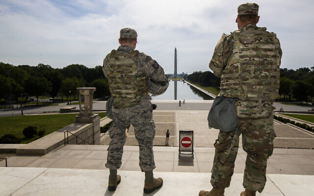 Members of the District of Columbia Army National Guard stand guard at the Lincoln Memorial in Washington, Wednesday, June 3, 2020, securing the area as protests continue following the death of George Floyd, a who died after being restrained by Minneapolis police officers. (AP Photo/Manuel Balce Ceneta) Members of the District of Columbia Army National Guard stand guard at the Lincoln Memorial in Washington, Wednesday, June 3, 2020, securing the area as protests continue following the death of George Floyd, a who died after being restrained by Minneapolis police officers. (AP Photo/Manuel Balce Ceneta)