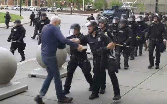 In this image from video provided by WBFO, a Buffalo police officer appears to shove a man who walked up to police on June 4, 2020, in Buffalo, New York. (Mike Desmond/WBFO via AP) In this image from video provided by WBFO, a Buffalo police officer appears to shove a man who walked up to police on June 4, 2020, in Buffalo, New York. (Mike Desmond/WBFO via AP)