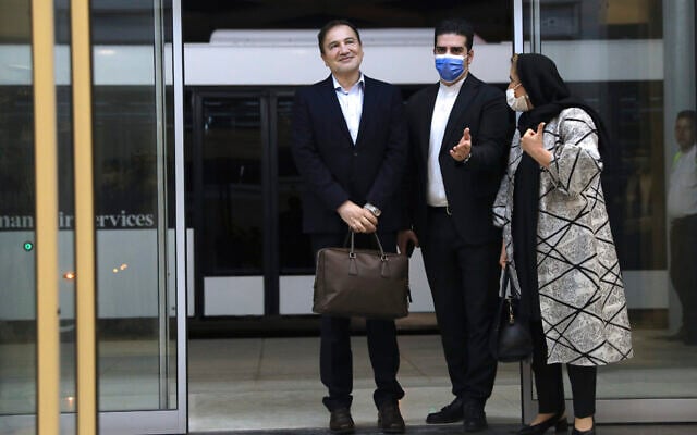 Iranian doctor based in Florida Matteo Taerri, left, is welcomed by an Iranian Foreign Ministry official as his wife stands at right, upon arrival at Tehran's Imam Khomeini Airport from the US after being part of a swap that saw a US Navy veteran held by Iran return to America, June 8, 2020. (Majid Asgaripour/Mehr News Agency via AP) Iranian doctor based in Florida Matteo Taerri, left, is welcomed by an Iranian Foreign Ministry official as his wife stands at right, upon arrival at Tehran's Imam Khomeini Airport from the US after being part of a swap that saw a US Navy veteran held by Iran return to America, June 8, 2020. (Majid Asgaripour/Mehr News Agency via AP)