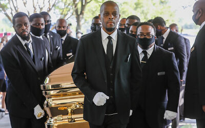 Pallbearers bring the coffin into The Fountain of Praise church in Houston for the funeral for George Floyd on June 9, 2020. (Godofredo A. Vásquez/Houston Chronicle via AP, Pool)