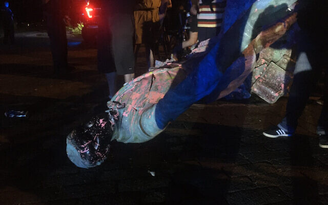 The statue of Confederate President Jefferson Davis is splattered with paint after it was toppled Wednesday night, June 10, 2020, along Monument Avenue in Richmond, Va. (Dylan Garner/Richmond Times-Dispatch via AP) The statue of Confederate President Jefferson Davis is splattered with paint after it was toppled Wednesday night, June 10, 2020, along Monument Avenue in Richmond, Va. (Dylan Garner/Richmond Times-Dispatch via AP)