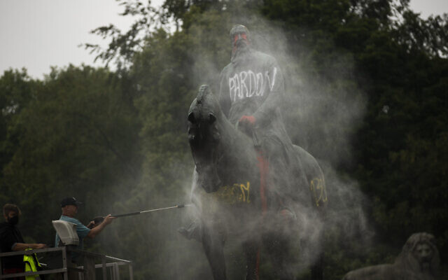 Workers clean graffiti from a statue of Belgium's King Leopold II in Brussels on June 11, 2020, that was targeted by protesters during a Black Lives Matter demonstration (AP Photo/Francisco Seco) Workers clean graffiti from a statue of Belgium's King Leopold II in Brussels on June 11, 2020, that was targeted by protesters during a Black Lives Matter demonstration (AP Photo/Francisco Seco)