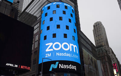 A photo of a sign for Zoom Video Communications ahead of its Nasdaq IPO in New York, April 18, 2019. (AP Photo/Mark Lennihan, File)