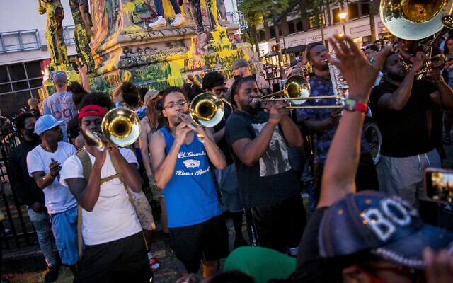 A band plays in front of the Confederate monument in Portsmouth, Virginia, during a demonstration on June 10, 2020 (Kristen Zeis/The Virginian-Pilot via AP) A band plays in front of the Confederate monument in Portsmouth, Virginia, during a demonstration on June 10, 2020 (Kristen Zeis/The Virginian-Pilot via AP)