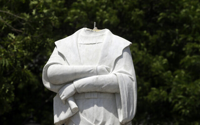 A damaged Christopher Columbus statue stands in a waterfront park near the traditionally Italian North End neighborhood of Boston, Massachusetts, on June 10, 2020 (AP Photo/Steven Senne, FILE) A damaged Christopher Columbus statue stands in a waterfront park near the traditionally Italian North End neighborhood of Boston, Massachusetts, on June 10, 2020 (AP Photo/Steven Senne, FILE)