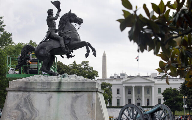 With the White House and the Washington Monument in the background, a National Park Service worker cleans a statue of President Andrew Jackson, June 11, 2020, near the White House in Washington, after protests over the death of George Floyd (AP Photo/Jacquelyn Martin) With the White House and the Washington Monument in the background, a National Park Service worker cleans a statue of President Andrew Jackson, June 11, 2020, near the White House in Washington, after protests over the death of George Floyd (AP Photo/Jacquelyn Martin)