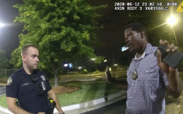 This screen grab taken from body camera video provided by the Atlanta Police Department shows Rayshard Brooks speaking with Officer Garrett Rolfe in the parking lot of a Wendy's restaurant, late Friday, June 12, 2020, in Atlanta. (Atlanta Police Department via AP) This screen grab taken from body camera video provided by the Atlanta Police Department shows Rayshard Brooks speaking with Officer Garrett Rolfe in the parking lot of a Wendy's restaurant, late Friday, June 12, 2020, in Atlanta. (Atlanta Police Department via AP)