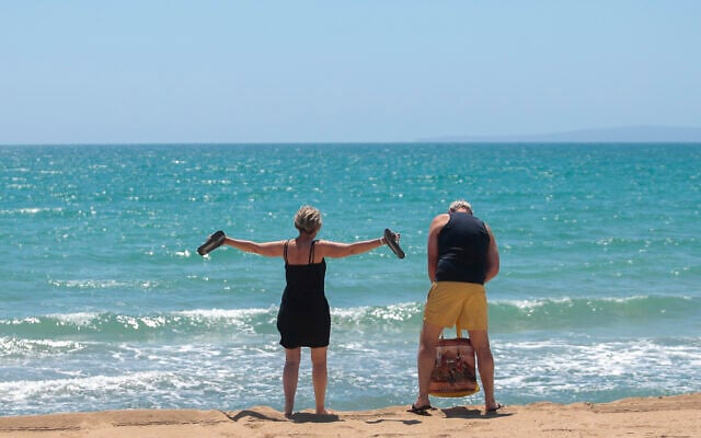 German tourists arrive at the beach of Palma de Mallorca, Spain, June 15, 2020. (Joan Mateu/AP) German tourists arrive at the beach of Palma de Mallorca, Spain, June 15, 2020. (Joan Mateu/AP)