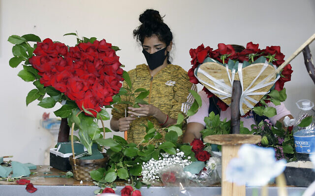 A florist prepares a floral arrangement on Mother's Day at the Los Angeles Flower Market in Los Angeles, on May 10, 2020. (AP Photo/Marcio Jose Sanchez, File) A florist prepares a floral arrangement on Mother's Day at the Los Angeles Flower Market in Los Angeles, on May 10, 2020. (AP Photo/Marcio Jose Sanchez, File)