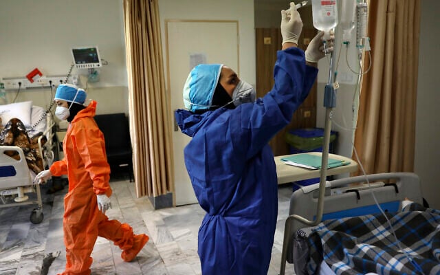 Nurses tend to COVID-19 patients at the Shohadaye Tajrish Hospital in Tehran, Iran, June 16, 2020. (AP Photo/Vahid Salemi) Nurses tend to COVID-19 patients at the Shohadaye Tajrish Hospital in Tehran, Iran, June 16, 2020. (AP Photo/Vahid Salemi)