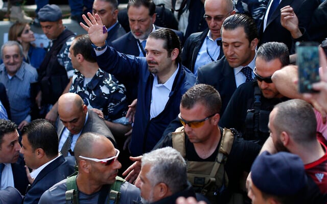 In this Sunday, May 8, 2016 file photo, Former Lebanese Prime Minister Saad Hariri, center, leader of Lebanon's parliamentary majority, waves to his supporters after he voted at a polling station during the municipal elections in Beirut, Lebanon. An explosion occurred earlier in June 2020 near the convoy of former Lebanese Prime Minister Saad Hariri when he was on a visit in a mountainous region in Lebanon's eastern Bekaa Valley, a Saudi-owned TV station reported Sunday, June 28. (AP Photo/Hassan Ammar) In this Sunday, May 8, 2016 file photo, Former Lebanese Prime Minister Saad Hariri, center, leader of Lebanon's parliamentary majority, waves to his supporters after he voted at a polling station during the municipal elections in Beirut, Lebanon. An explosion occurred earlier in June 2020 near the convoy of former Lebanese Prime Minister Saad Hariri when he was on a visit in a mountainous region in Lebanon's eastern Bekaa Valley, a Saudi-owned TV station reported Sunday, June 28. (AP Photo/Hassan Ammar)