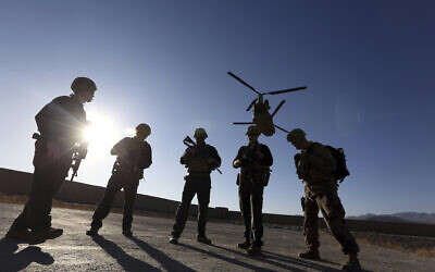 Illustrative: American soldiers wait on the tarmac in Logar province, Afghanistan, November 30, 2017. (AP Photo/Rahmat Gul)