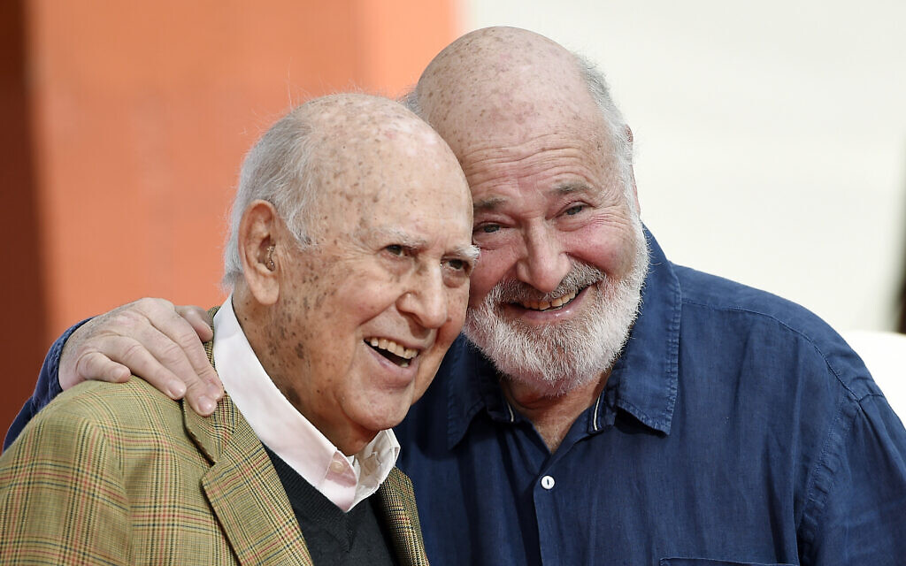 In this April 7, 2017 file photo, Carl Reiner, left, and his son Rob Reiner pose together following their hand and footprint ceremony at the TCL Chinese Theatre in Los Angeles. (Chris Pizzello/Invision/AP, File)