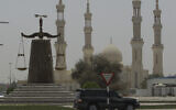 A justice symbol monument is seen in front of a mosque in Ras al Khaimah, United Arab Emirates, May 3, 2012. (Kamran Jebreili/AP)