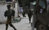 Illustrative -- Israeli troops patrol the streets of the West Bank city of Jenin, January 18, 2018. (AP Photo/Majdi Mohammed)