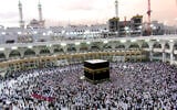 Muslim pilgrims circumambulate the Kaaba, the cubic building at the Grand Mosque, durning the hajj pilgrimage in the Muslim holy city of Mecca, Saudi Arabia, on August 13, 2019. (Amr Nabil/AP)