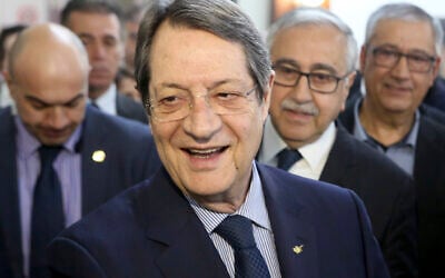 Cyprus' President Nicos Anastasiades, center, at the Ledra Palace Hotel inside the UN controlled buffer zone in divided capital Nicosia, Cyprus, Monday, Feb. 3, 2020. (AP/Petros Karadjias)