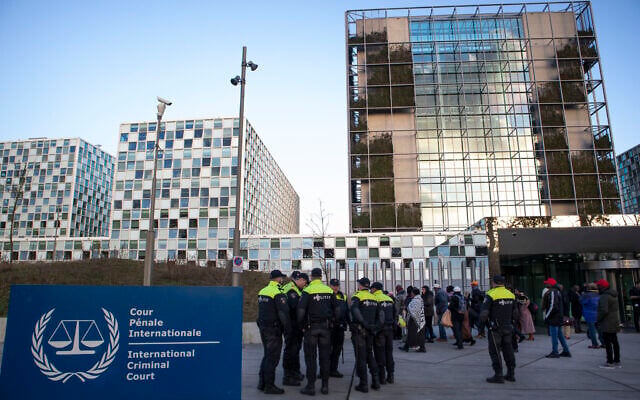 Illustrative: Police escort a group of supporters of former Ivory Coast president Laurent Gbagbo outside the International Criminal Court in The Hague, Netherlands, Thursday, Feb. 6, 2020. (AP/Peter Dejong) Illustrative: Police escort a group of supporters of former Ivory Coast president Laurent Gbagbo outside the International Criminal Court in The Hague, Netherlands, Thursday, Feb. 6, 2020. (AP/Peter Dejong)