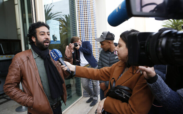 Journalist and activist Omar Radi speaks to the media after his hearing at the Casablanca Courthouse, In Casablanca, Morocco, March 5, 2020 (AP Photo/Abdeljalil Bounhar) Journalist and activist Omar Radi speaks to the media after his hearing at the Casablanca Courthouse, In Casablanca, Morocco, March 5, 2020 (AP Photo/Abdeljalil Bounhar)