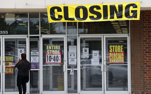 A woman walks into a closing Gordmans store, May 28, 2020, in St. Charles, Missouri. (AP Photo/Jeff Roberson) A woman walks into a closing Gordmans store, May 28, 2020, in St. Charles, Missouri. (AP Photo/Jeff Roberson)