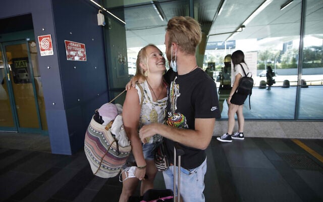Andrea Monti hugs his girlfriend Katherina Scherf who just arrived from Duesseldorf, Germany at Rome's Fiumicino airport on June 3, 2020. (AP Photo/Alessandra Tarantino) Andrea Monti hugs his girlfriend Katherina Scherf who just arrived from Duesseldorf, Germany at Rome's Fiumicino airport on June 3, 2020. (AP Photo/Alessandra Tarantino)