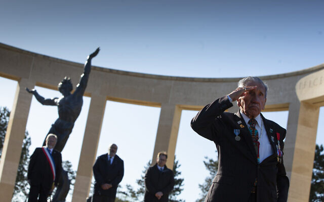 Charles Norman Shay, D-Day WWII veteran and Penobscot Elder from Maine, salutes after laying a wreath during a D-Day 76th anniversary ceremony at the Normandy American Cemetery in Colleville-sur-Mer, Normandy, France, June 6, 2020 (AP Photo/Virginia Mayo)