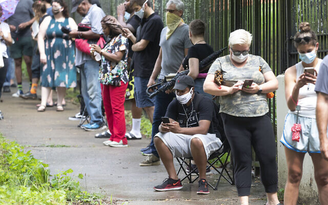 People wait in line to vote, June 9, 2020, at Central Park in Atlanta (AP Photo/John Bazemore)