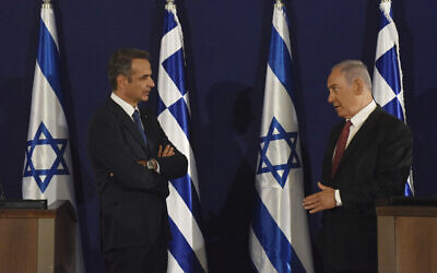 Prime Minister Benjamin Netanyahu, right, and Greek Prime Minister Kyriakos Mitsotakis give joint statements in Jerusalem, June 16, 2020. (Debbie Hill, UPI Pool via AP) Prime Minister Benjamin Netanyahu, right, and Greek Prime Minister Kyriakos Mitsotakis give joint statements in Jerusalem, June 16, 2020. (Debbie Hill, UPI Pool via AP)