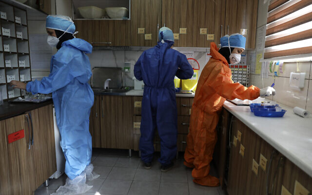 In this Tuesday, June 16, 2020, photo, nurses prepare medicines for COVID-19 patients at the Shohadaye Tajrish Hospital in Tehran, Iran. (AP Photo/Vahid Salemi) In this Tuesday, June 16, 2020, photo, nurses prepare medicines for COVID-19 patients at the Shohadaye Tajrish Hospital in Tehran, Iran. (AP Photo/Vahid Salemi)