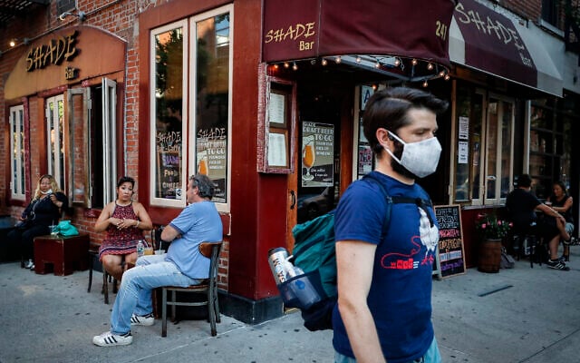 Customers dine outside Shade Bar NYC, Monday, June 22, 2020, in New York. New York City ventured into a crucial stage of reopening as stores let people in Monday, offices brought workers back, restaurants seated customers outdoors and residents both welcomed and worried about rebounding from the nation’s deadliest coronavirus outbreak. (AP Photo/John Minchillo) Customers dine outside Shade Bar NYC, Monday, June 22, 2020, in New York. New York City ventured into a crucial stage of reopening as stores let people in Monday, offices brought workers back, restaurants seated customers outdoors and residents both welcomed and worried about rebounding from the nation’s deadliest coronavirus outbreak. (AP Photo/John Minchillo)