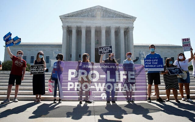 Anti-abortion protesters wait outside the Supreme Court for a decision, June 29, 2020, in Washington on the Louisiana case, Russo v. June Medical Services LLC. (AP Photo/Patrick Semansky) Anti-abortion protesters wait outside the Supreme Court for a decision, June 29, 2020, in Washington on the Louisiana case, Russo v. June Medical Services LLC. (AP Photo/Patrick Semansky)