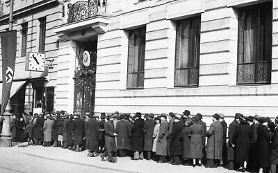 Austrian Jews line up outside the Polish consulate seeking documents in order to escape Nazified Austria, March 22, 1938. (AP Photo)