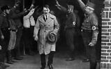 In this Dec. 5, 1931 photo, Adolf Hitler, leader of the National Socialists, is saluted as he leaves the party's Munich headquarters (AP Photo, File)