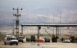 Illustrative: An Israeli soldier stands at the entrance to the Allenby border crossing, the main border crossing for Palestinians from the West Bank traveling to neighboring Jordan and beyond, March 10, 2014. (Sebastian Scheiner/AP)
