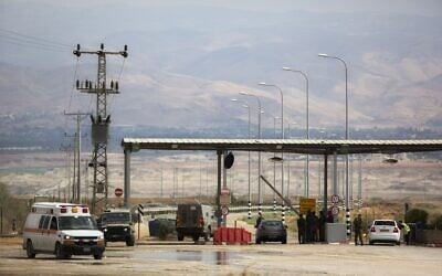 Illustrative: An Israeli soldier stands at the entrance to the Allenby border crossing, the main border crossing for Palestinians from the West Bank traveling to neighboring Jordan and beyond, March 10, 2014. (Sebastian Scheiner/AP)