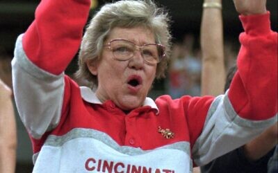 Former Cincinnati Reds owner Marge Schott does the wave during a game at Riverfront Stadium, September 1, 1995, in Cincinnati. (AP Photo/Tom Uhlman)