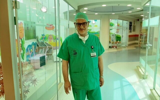 Dr. Alain Serraf, head of the International Congenital Heart Center at Sheba's children's hospital, after conducting surgery on a 10-day-old Syrian baby on June 14, 2020. (Sheba Medical Center) Dr. Alain Serraf, head of the International Congenital Heart Center at Sheba's children's hospital, after conducting surgery on a 10-day-old Syrian baby on June 14, 2020. (Sheba Medical Center)