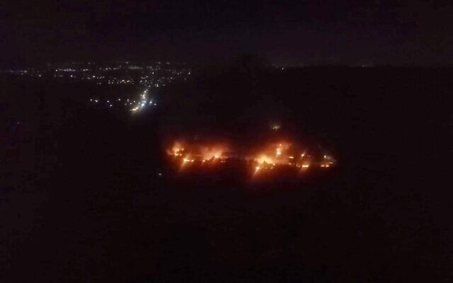 Fires caused by a reported Israeli attack on a site in Masyaf in northern Syria on June 4, 2020. (Screen capture) Fires caused by a reported Israeli attack on a site in Masyaf in northern Syria on June 4, 2020. (Screen capture)