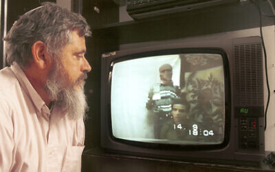Yehuda Wachsman, father of slain IDF soldier Nachshon Wachsman, watches a ransom video of his son in Hamas captivity, in an undated photo. (Yossi Zamir/Flash90)
